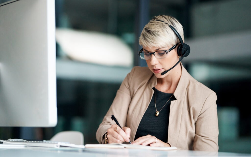 Young Receptionist Wearing A Headset, Representing Top-Tier Australian Virtual Receptionist Services Offered By Ruby Receptionist
