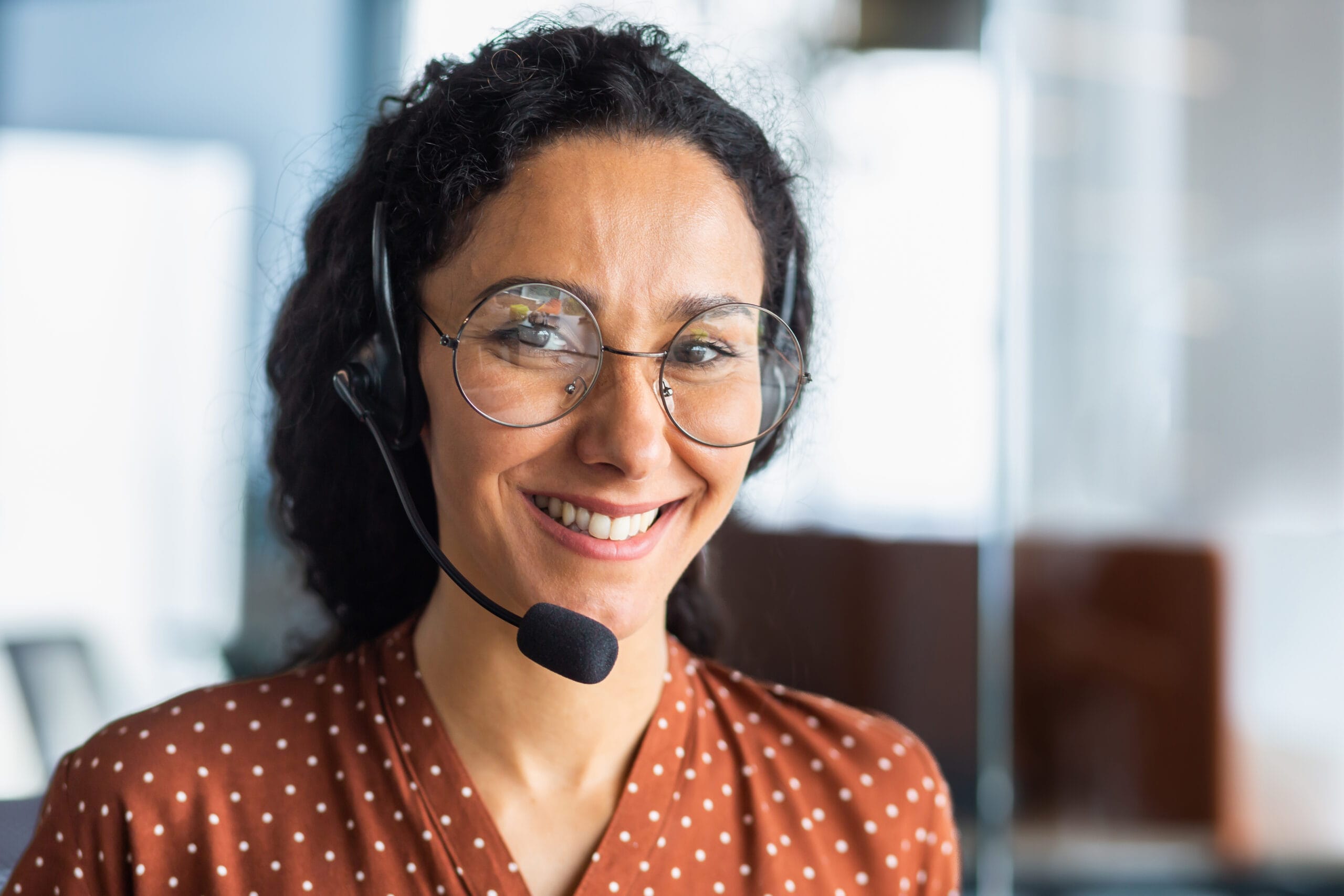 Receptionist woman wearing a headset, representing Ruby Receptionist's Virtual Appointment Scheduling service.